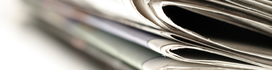 A close up of folded newspapers