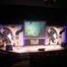 Lecture theatre with two podiums, large backdrop and projector screen